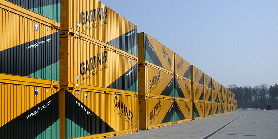 Lambach container terminal with stacked TAILWIND containers, crane in operation, rail and road connections, modern operations