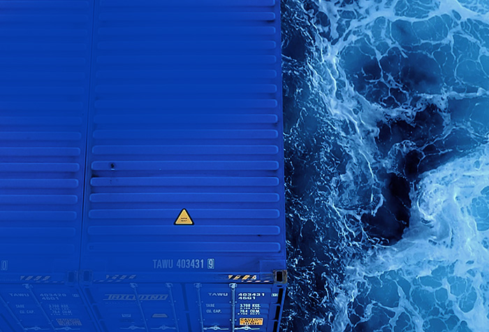 Blue Tailwind containers on water