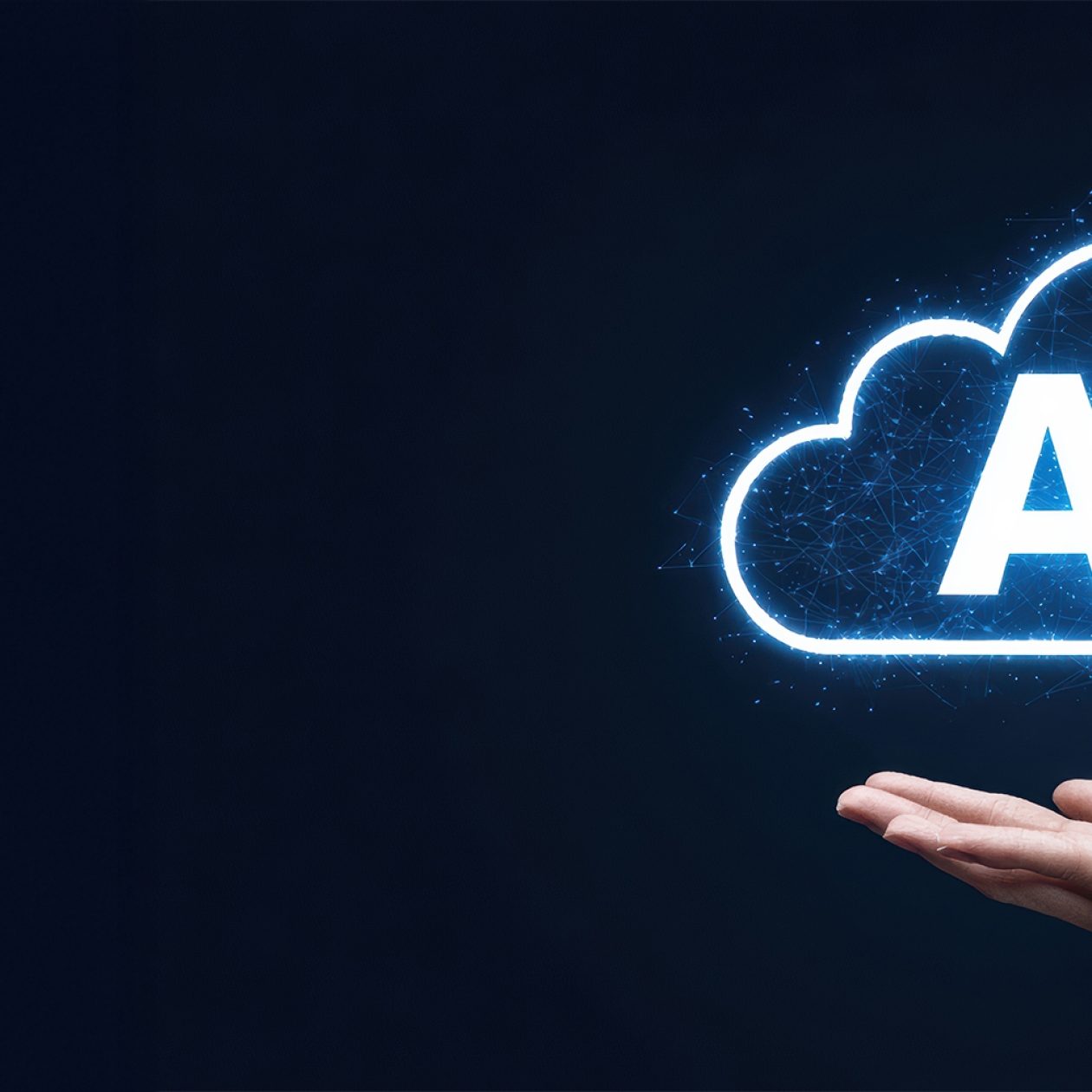 A hand holds a glowing, blue and white digital cloud shape, with the white capital letters "AI" (Artificial Intelligence) in the center. The image symbolizes cloud computing and AI technology.
