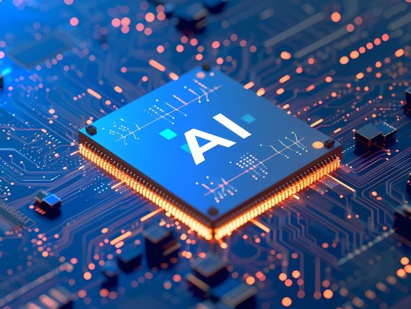 Close-up of a blue, glowing microchip labeled AI (Artificial Intelligence) on an orange and blue illuminated computer board. The image symbolizes artificial intelligence (AI), machine learning, data processing, computing power and modern AI hardware.