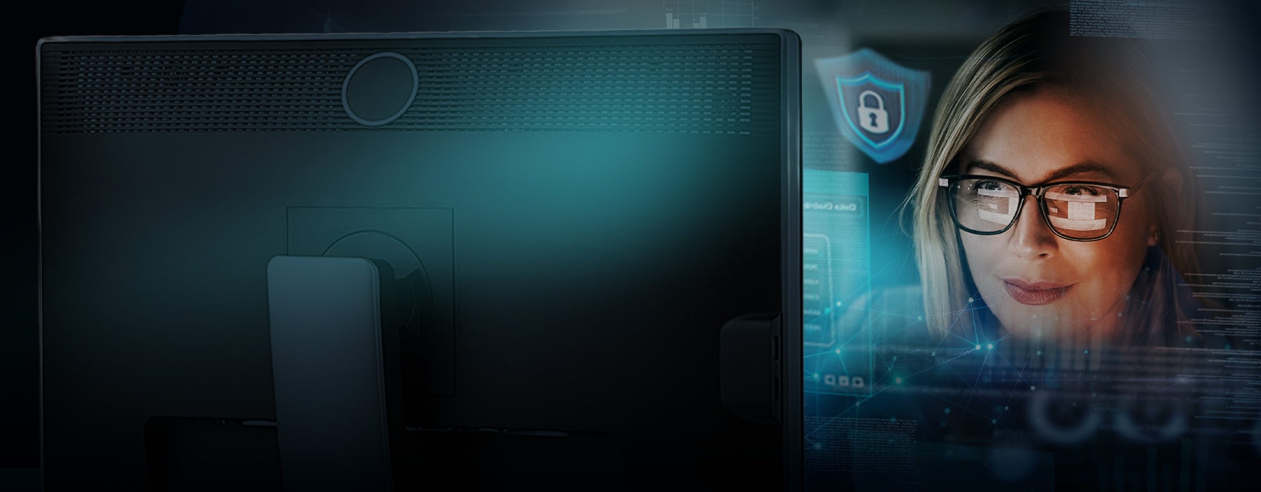 An IT specialist looking at a monitor with overlaid cybersecurity symbols and data analytics representing digital sovereignty.