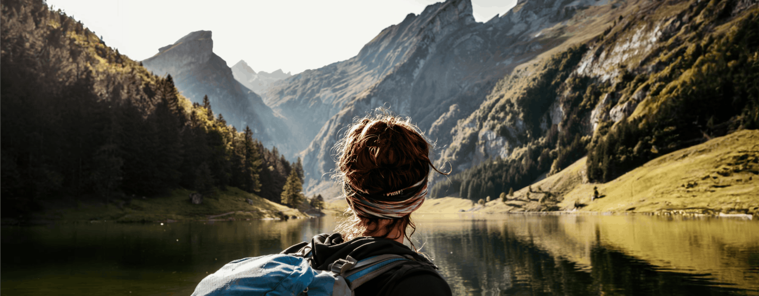 Woman with backpack in the mountains