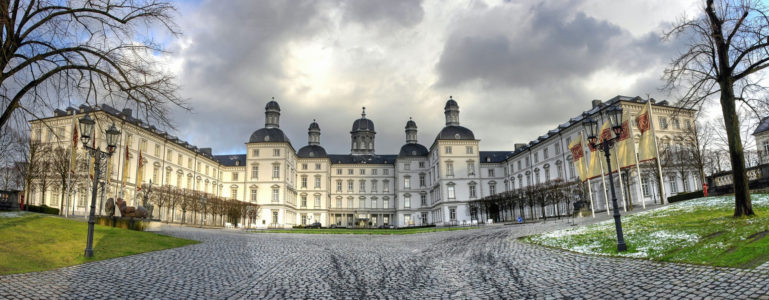 Bensberg Castle in Bergisch Gladbach with large cobblestone forecourt and baroque architecture